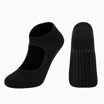 Black yoga socks with textured sole on a white background
