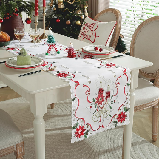 Decorated Christmas table with a tablecloth featuring festive designs.